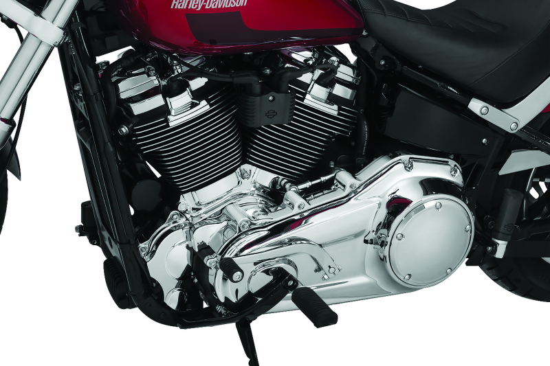 Kuryakyn Chrome Inner Primary Cover for Harley Davidson motorcycles, showcasing a shiny, reflective finish on the cover part.