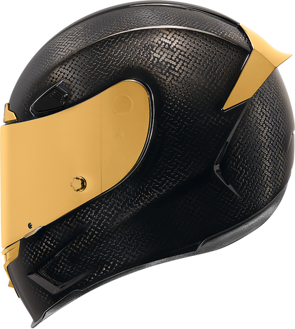 Black and gold ICON Airframe Pro™ helmet with carbon shell, small size, featuring sleek aerodynamic design and detailed graphics.