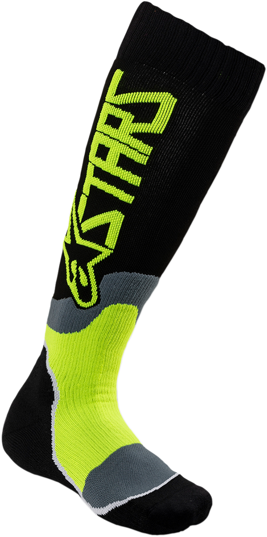Alpinestars MX Plus 2 youth protective gear socks in black and yellow, medium/large size, featuring reinforced comfort and support.