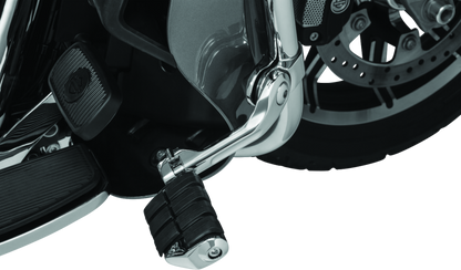 Kuryakyn Tour-Tech Cruise 6-inch mount arm with chrome finish and dually ISO pegs on 1-1/4 inch engine guards for motorcycle cruising