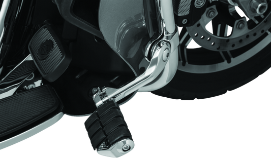 Kuryakyn Tour-Tech Cruise 6-inch mount arm with chrome finish and dually ISO pegs on 1-1/4 inch engine guards for motorcycle cruising