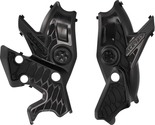 Acerbis X-Grip black frame guards mounted on motorcycle body, providing protection and a sleek look for bike frames.