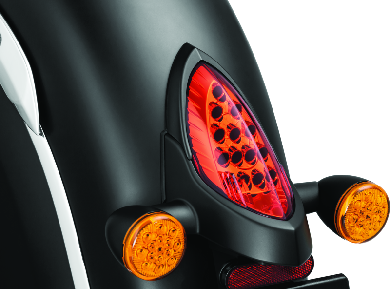 Kuryakyn satin black tail light top trim for Indian motorcycles, designed to enhance rear lighting and style.