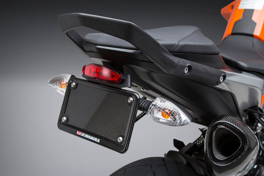 YOSHIMURA Fender Eliminator Kit for KTM motorcycle, showing sleek black tail tidy with mounting hardware and license plate holder.