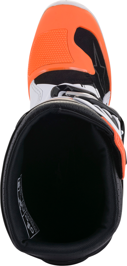 Alpinestars Youth Tech 7S motorcycle boots in black, orange, and white with adjustable straps and protective features.