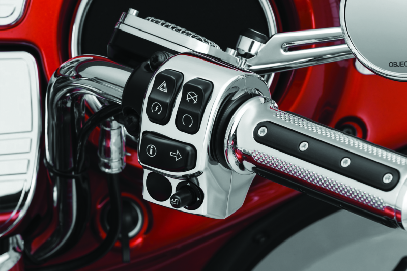 Kuryakyn Chrome Switch Housings for Harley Davidson motorcycle, showing polished chrome finish and detailed switch components.