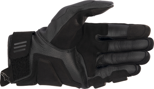 Alpinestars Phenom Air motorcycle gloves in black and white, medium size, featuring protective padding and breathable design.