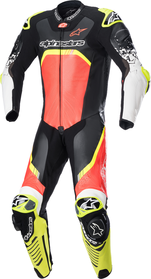 Alpinestars GP Tech Suit v4 in black, red fluorescent, and yellow fluorescent, displayed on a mannequin, showing detailed leather construction.