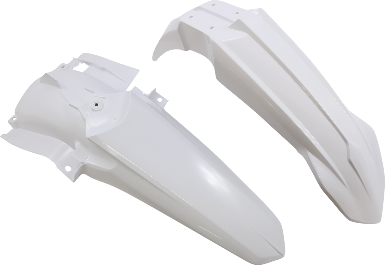 A white Acerbis standard replacement body kit for motorcycles, shown on a work surface with parts and tools nearby.