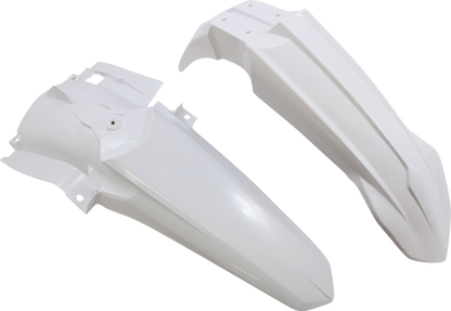 A white Acerbis standard replacement body kit for motorcycles, shown on a work surface with parts and tools nearby.