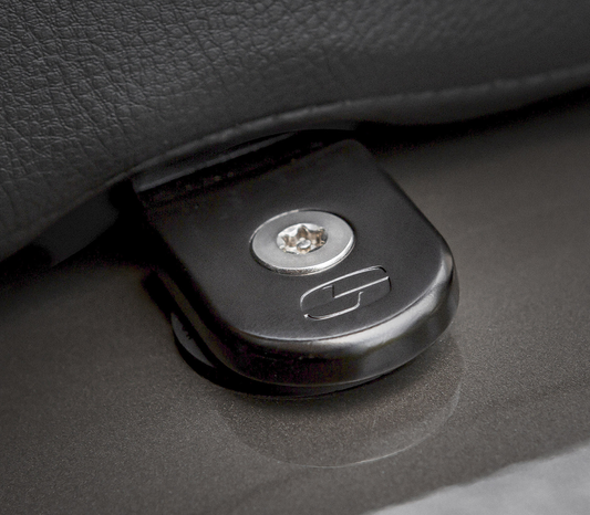 Black Saddlemens Security Seat Screw for motorcycle seats, shown in close-up with threading details against a neutral background.