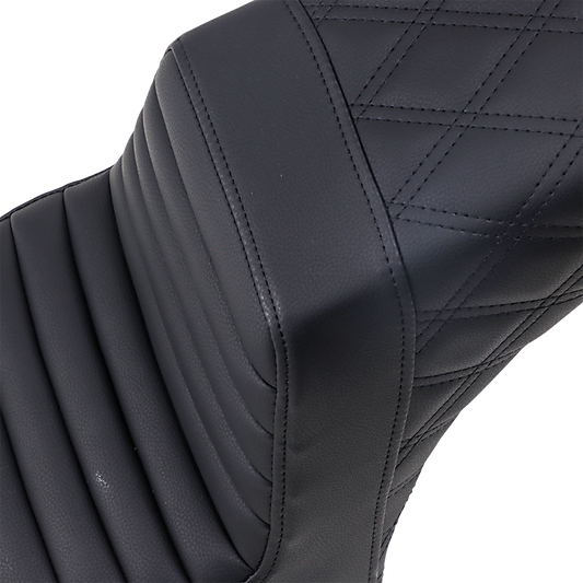 Black Saddlemens Step Up Seat by Bill's Exhausts with front tuck-n-roll and rear lattice stitch design on a motorcycle seat.