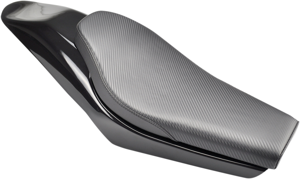 Carbon fiber SADDLEMEN Champ motorcycle seat by Bill's Exhausts, showcasing sleek design and ergonomic shape.