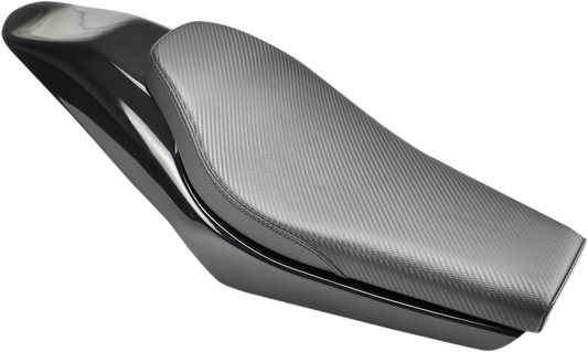 Carbon fiber SADDLEMEN Champ motorcycle seat by Bill's Exhausts, showcasing sleek design and ergonomic shape.