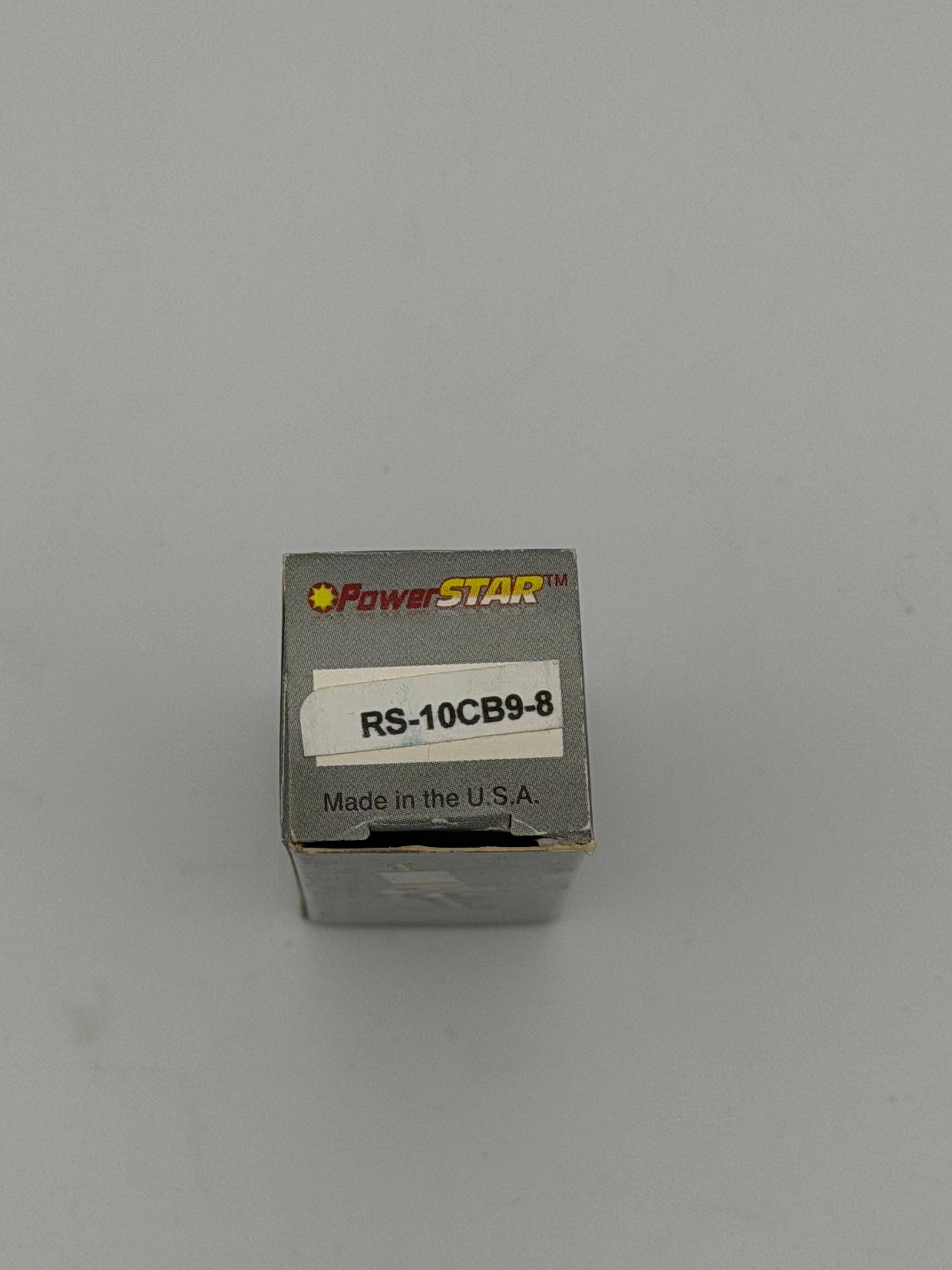 PowerStar RS-10CB9-8 spark plug with metal shell and ceramic insulator, designed for automotive engines.