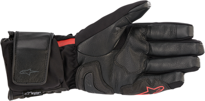 Black ALPINESTARS HT-7 Heat Tech Drystar® gloves in medium size, shown with textured fabric and reinforced palms.