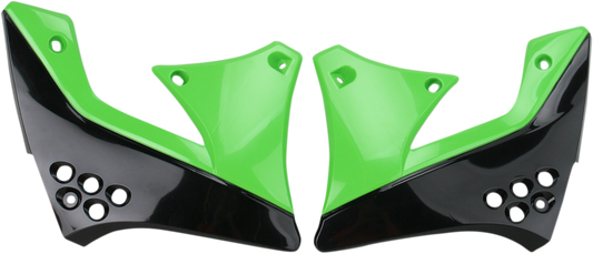 Acerbis black and green radiator shrouds for motorcycle, displayed on a body part with vent details and branding accents.