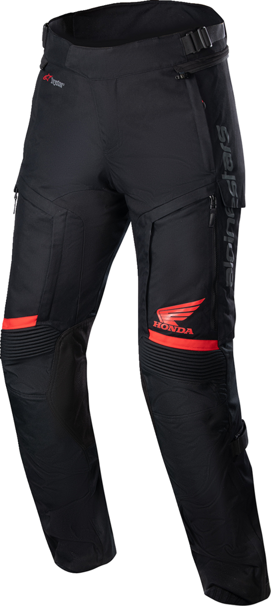 Black and red Alpinestars Honda Bogotá Pro Drystar® motorcycle pants in medium size, featuring protective armor and durable fabric.