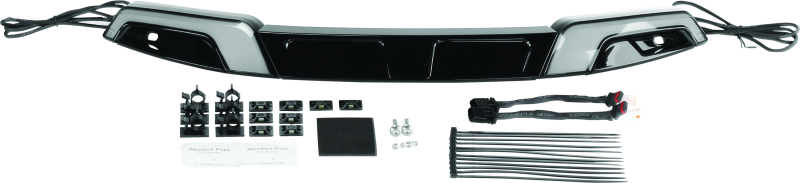 Kuryakyn Tracer windshield trim in black for Harley Davidson FLH models, shown installed on motorcycle with sleek design