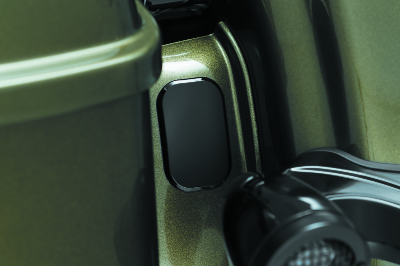 Black Kuryakyn antenna hole filler for Harley Davidson models, designed to cover antenna holes with a sleek finish.