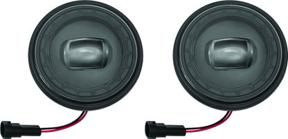 Kuryakyn Orbit 4-1/2 inch passing lamps with black finish mounted on motorcycle handlebars.
