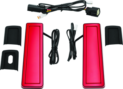 Kuryakyn Tracer Filler Panel Lights with red lens on custom LED saddlebag accents for motorcycle.