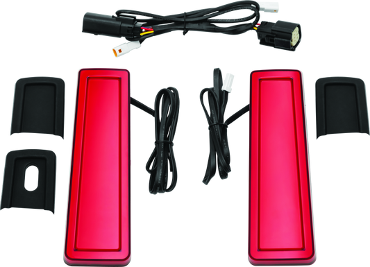 Kuryakyn Tracer Filler Panel Lights with red lens on custom LED saddlebag accents for motorcycle.