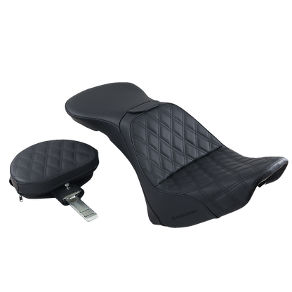 Black Saddlemens Explorer Seat with backrest and lattice stitching, designed for FLSTN motorcycles, by Bill's Exhausts.