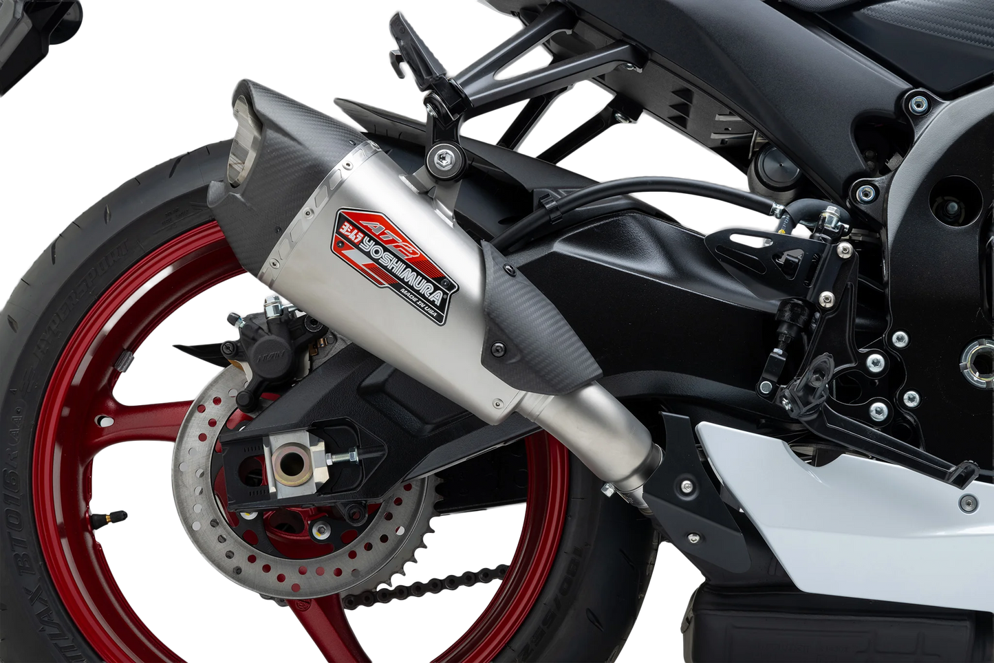 YOSHIMURA stainless steel street exhaust with carbon fiber end cap for AT2 motorcycle, featuring sleek design and durable construction.