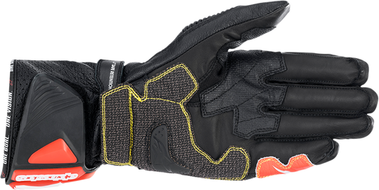 Alpinestars GP Tech v2 motorcycle gloves in black, white, and fluo red, size 2XL, showing protective knuckles and breathable fabric.
