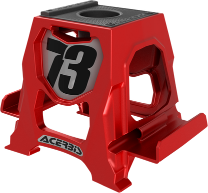 Red Acerbis phone stand by Bill's Exhausts, displayed as a sleek body-shaped accessory for holding smartphones.