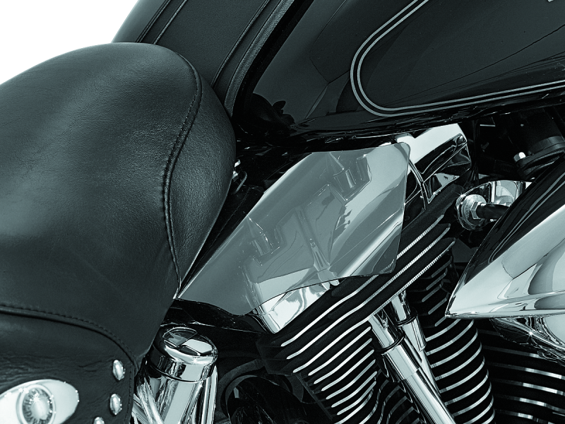 Kuryakyn Saddle Shields heat deflectors for Harley Davidson Softail motorcycle, 2000-2017, mounted on the bike's saddle area.