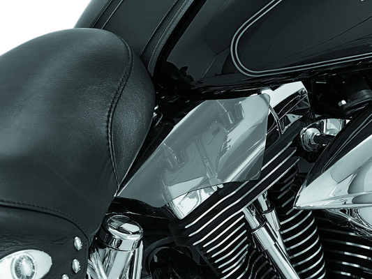 Kuryakyn Saddle Shields heat deflectors for Harley Davidson Softail motorcycle, 2000-2017, mounted on the bike's saddle area.