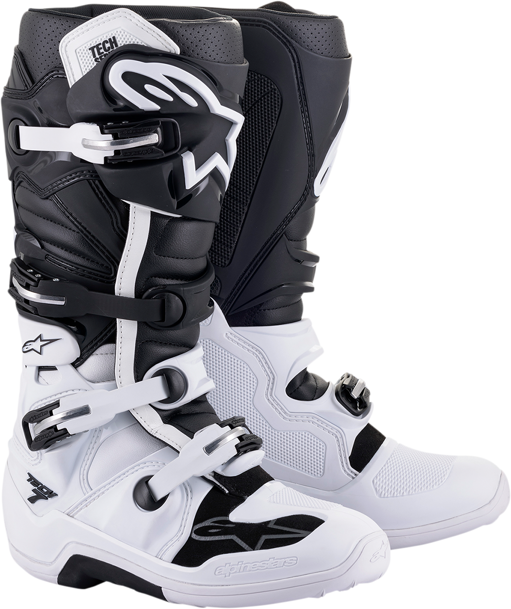 Alpinestars Tech 7 motocross boots in white and black, US size 10, with protective features and sturdy construction.
