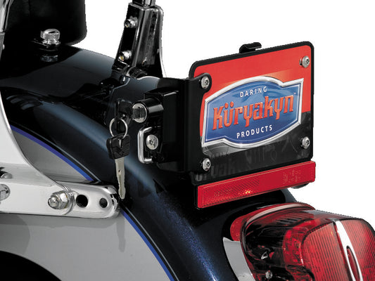 Kuryakyn black helmet lock with license plate mount for secure motorcycle helmet storage, shown attached to a vehicle.