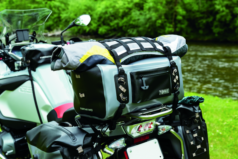 Kuryakyn Torke 35L dry duffle bag showing waterproof gear storage with adjustable straps and durable material for powersports.