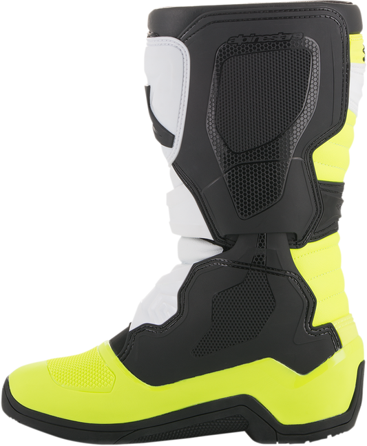 Alpinestars Tech 3S motocross boots in black, white, and fluorescent yellow with protective design and branding details.