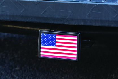 Kuryakyn Freedom Flag LED hitch cover in black for 1-1/4 inch and 2-inch receiver hitches, featuring LED illumination.