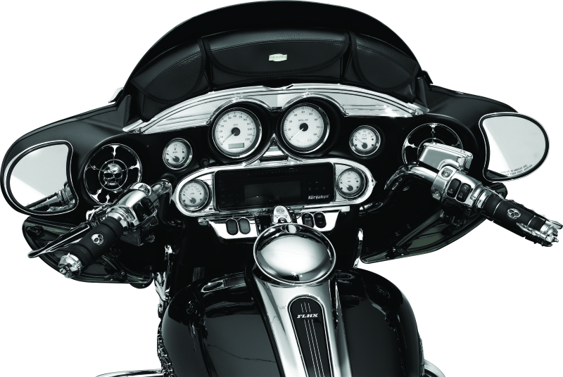 Chrome Kuryakyn Stereo Accent for 1996-2013 Harley-Davidson FL Touring models, shown mounted on motorcycle dashboard.