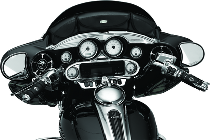 Chrome Kuryakyn Stereo Accent for 1996-2013 Harley-Davidson FL Touring models, shown mounted on motorcycle dashboard.