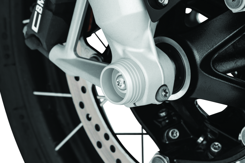 Kuryakyn Lodestar front axle sliders on BMW R1200GS and RT motorcycle, providing protection for the front wheel and axle.