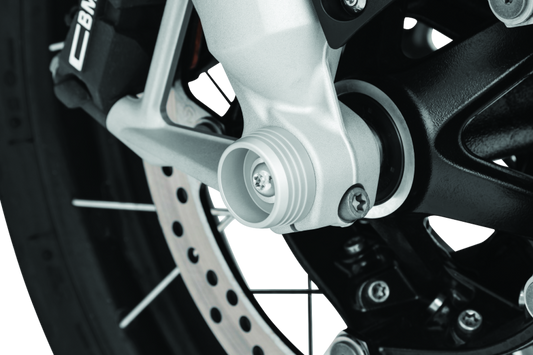 Kuryakyn Lodestar front axle sliders on BMW R1200GS and RT motorcycle, providing protection for the front wheel and axle.
