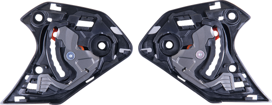 Alpinestars Supertech R10 shield mechanism in black, featuring detailed components and branding, on a plain background.
