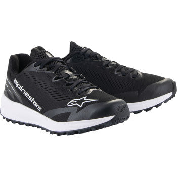 Alpinestars Meta Road V2 black and white motorcycle shoes with white soles, US 10.5, featuring sleek design and durable material.