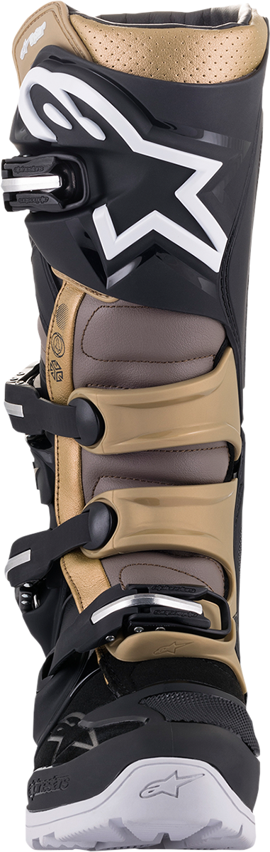 Alpinestars Tech 7 Enduro Drystar® motorcycle boots in black, gray, and gold with rugged design and protective features.