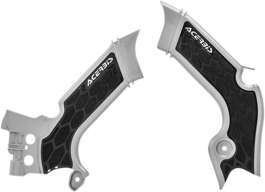A set of Acerbis X-Grip frame guards in silver and black for motorcycle protection, shown on a body frame.