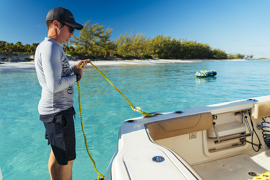 Water tow rope for two riders from AIRHEAD SPORTS GROUP, designed for water sports, with sturdy handles and bright color for visibility.