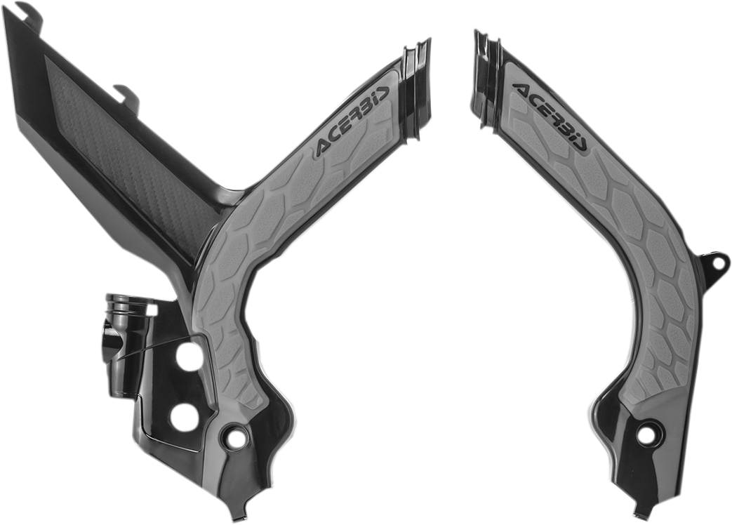 A close-up of black and silver Acerbis X-Grip frame guards on a motorcycle, showcasing their durable body protection design.