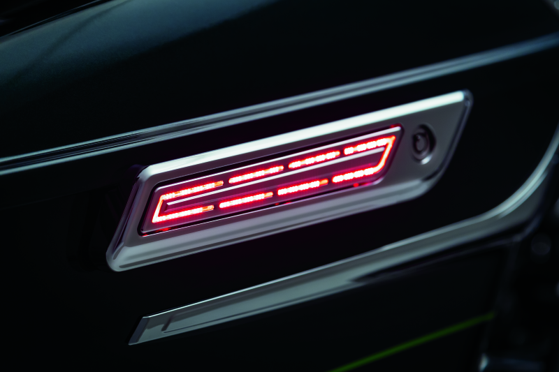 Kuryakyn LED saddlebag hinge accents for Harley Davidson with Chip-on-Board LED technology, showcasing sleek motorcycle accessory details.