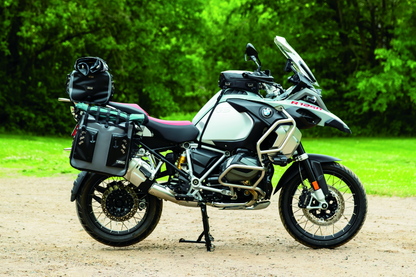 Kuryakyn Torke 7L dry tank bag with backpack straps, waterproof design, mounted on motorcycle fuel tank for secure storage